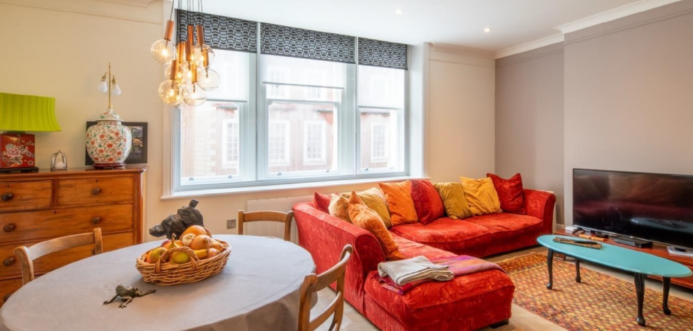 Close-up of vertical sliding secondary glazing unit in a Bridge of Allan Victorian home showing discreet internal framing.